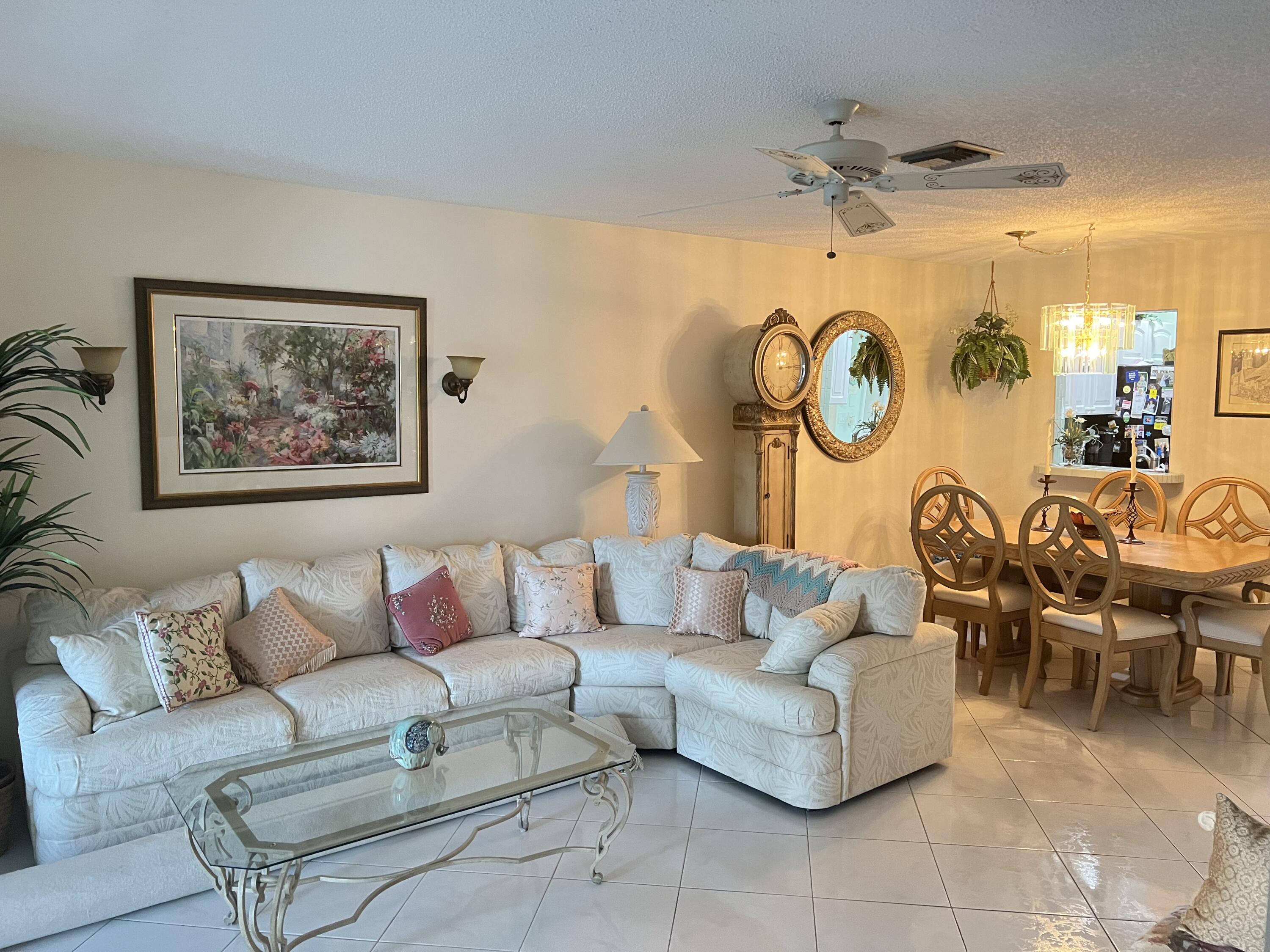 6877 Moonlit Drive Delray Beach, FL 33446 - Photo 30 of 45 a living room with furniture and a large window