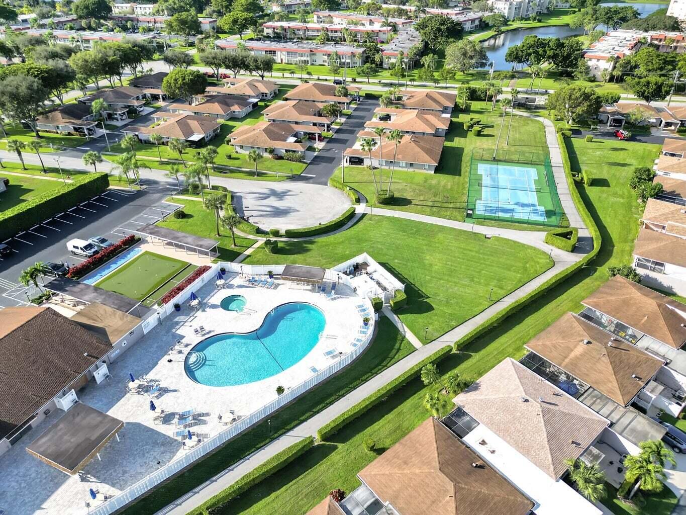 6877 Moonlit Drive Delray Beach, FL 33446 - Photo 40 of 45 an aerial view of a pool patio swimming pool and outdoor seating