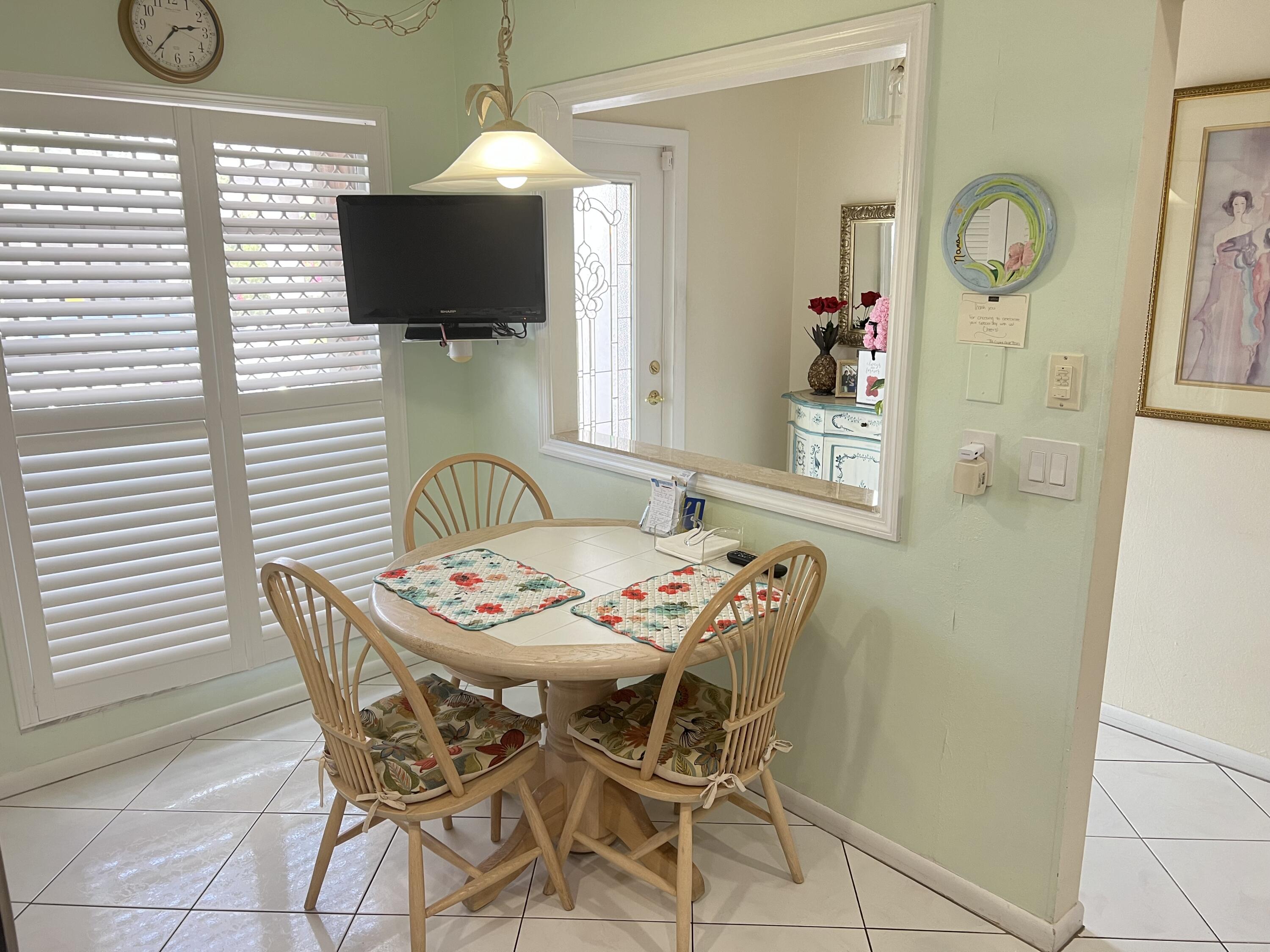 6877 Moonlit Drive Delray Beach, FL 33446 - Photo 4 of 45 a dining room with furniture and wooden floor