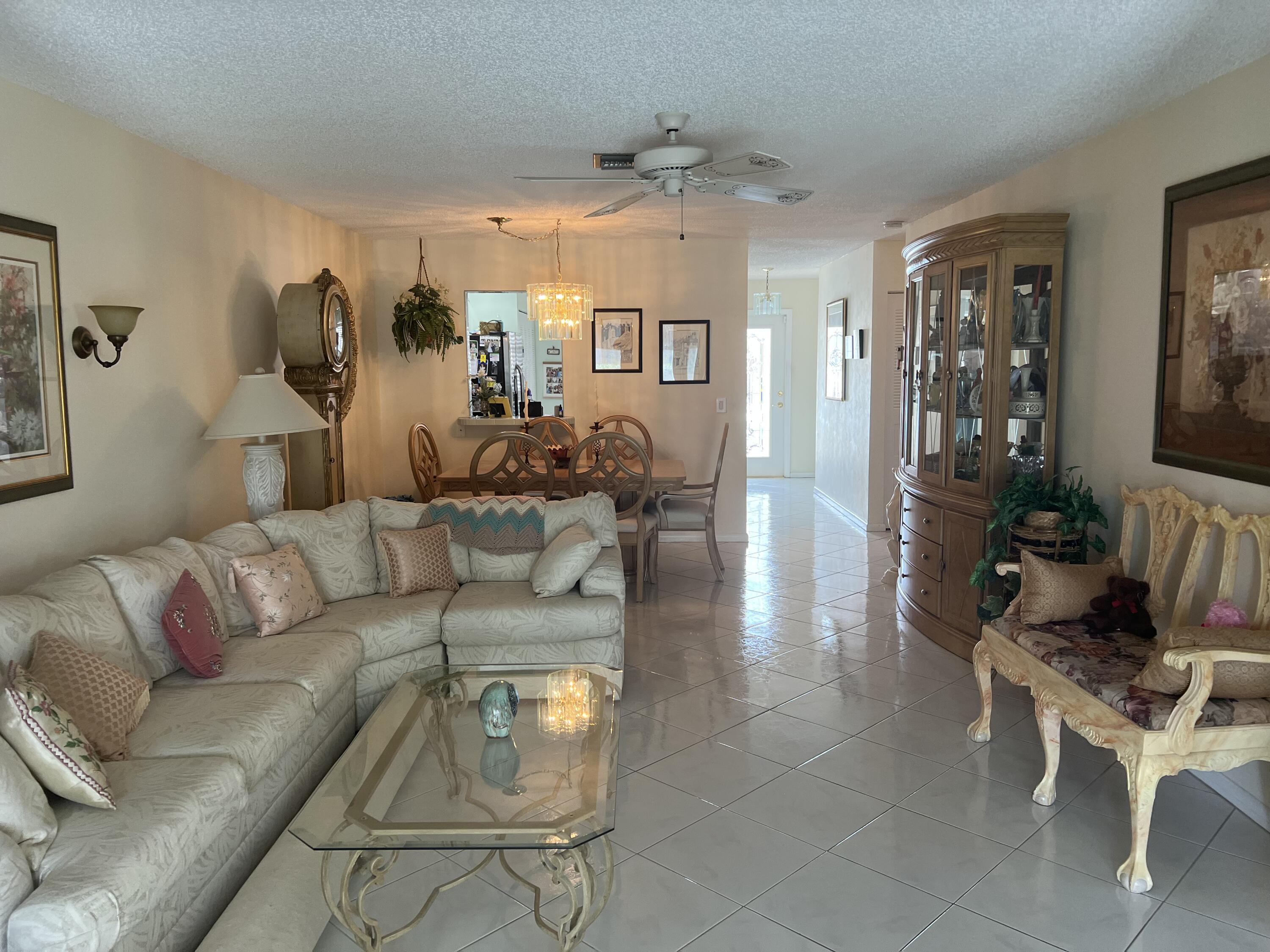 6877 Moonlit Drive Delray Beach, FL 33446 - Photo 5 of 45 a living room with furniture and wooden floor