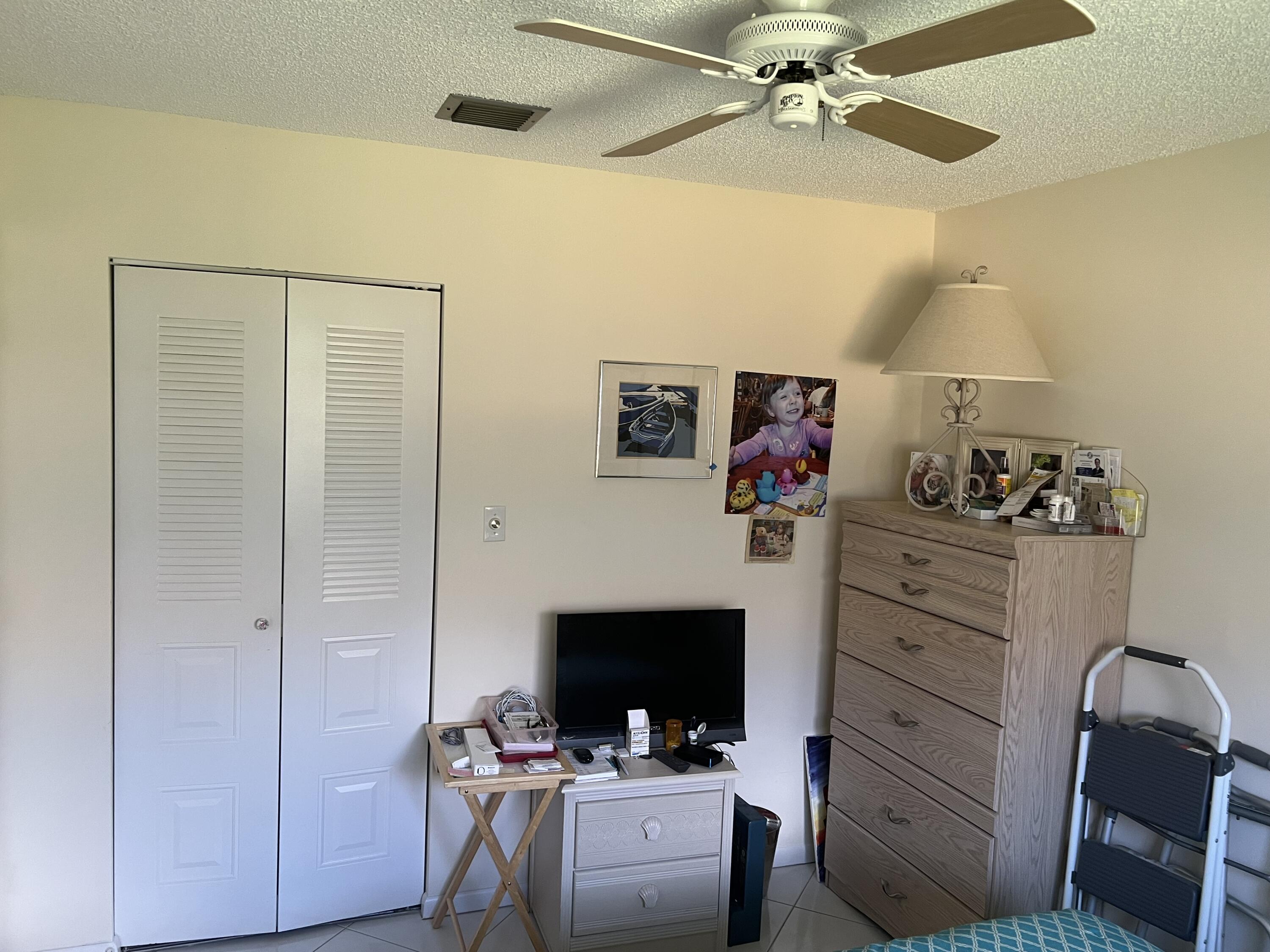 6877 Moonlit Drive Delray Beach, FL 33446 - Photo 9 of 45 a living room with furniture and a flat screen tv