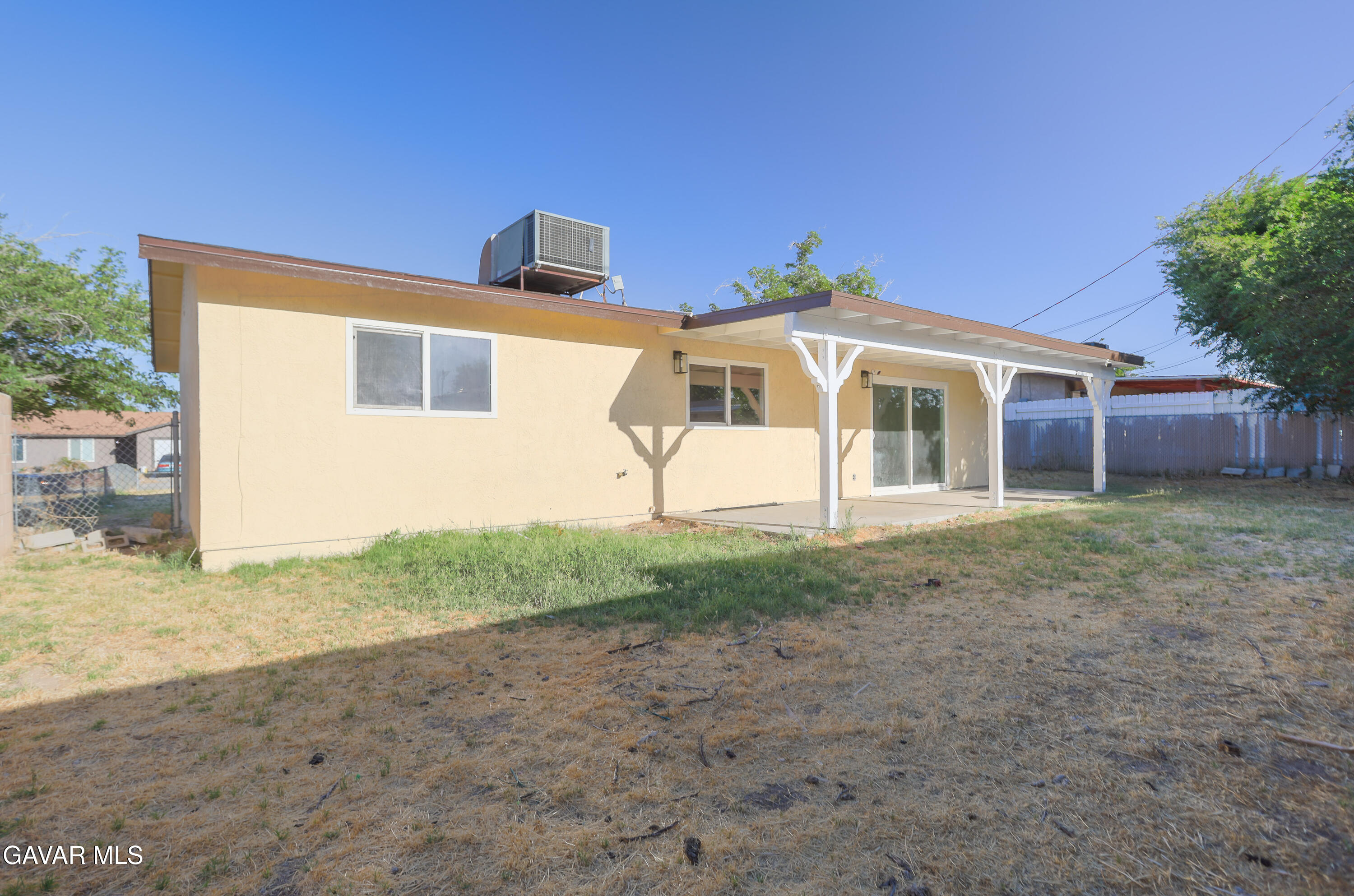 3340 West Roxbury Street Rosamond, CA 93560 - Photo 19 of 20 a front view of a house with garden
