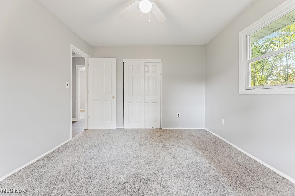 410 Longview Road Medina, OH 44256 - Photo 24 of 50 Unfurnished bedroom featuring ceiling fan, carpet floors, and a closet