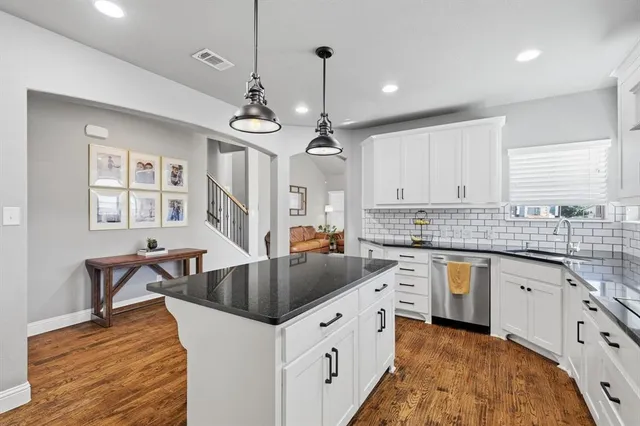 a view of entryway with wooden floor and stairs