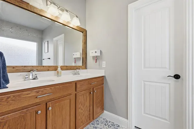 a bathroom with a tub and a view of bathroom