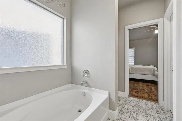 a en suite bathroom with a sink a mirror and a shower