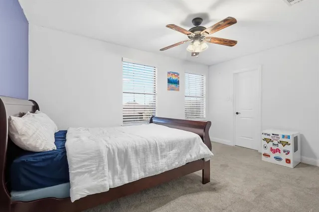 a view of an chairs and backyard in the backyard