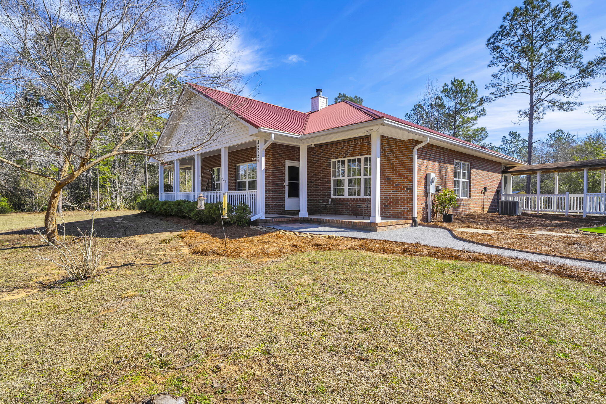 4398 Wilkerson Bluff Road Holt, FL 32564 - Photo 12 of 110 a front view of a house with a yard