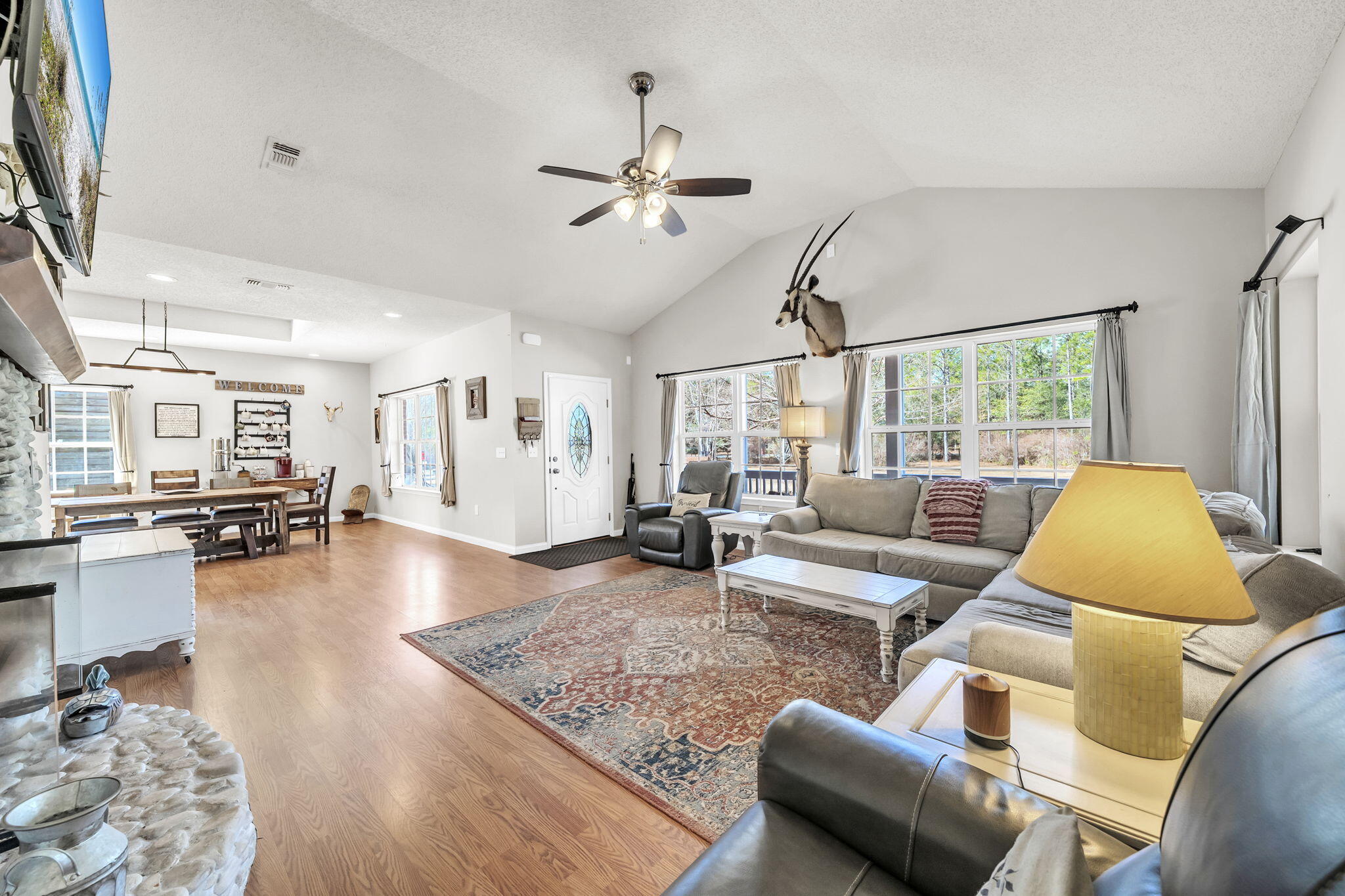 4398 Wilkerson Bluff Road Holt, FL 32564 - Photo 19 of 110 a living room with furniture and a large window