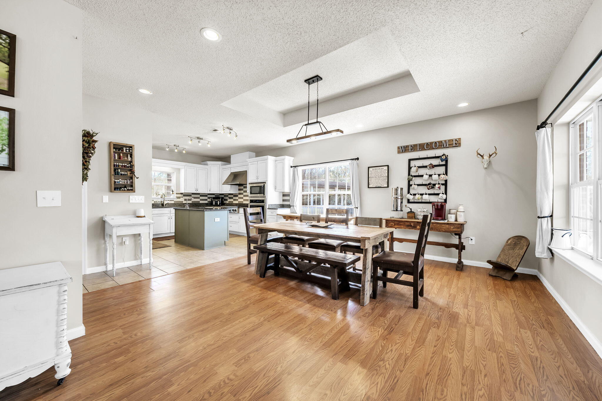 4398 Wilkerson Bluff Road Holt, FL 32564 - Photo 20 of 110 a living room with stainless steel appliances kitchen island granite countertop furniture and a wooden floors