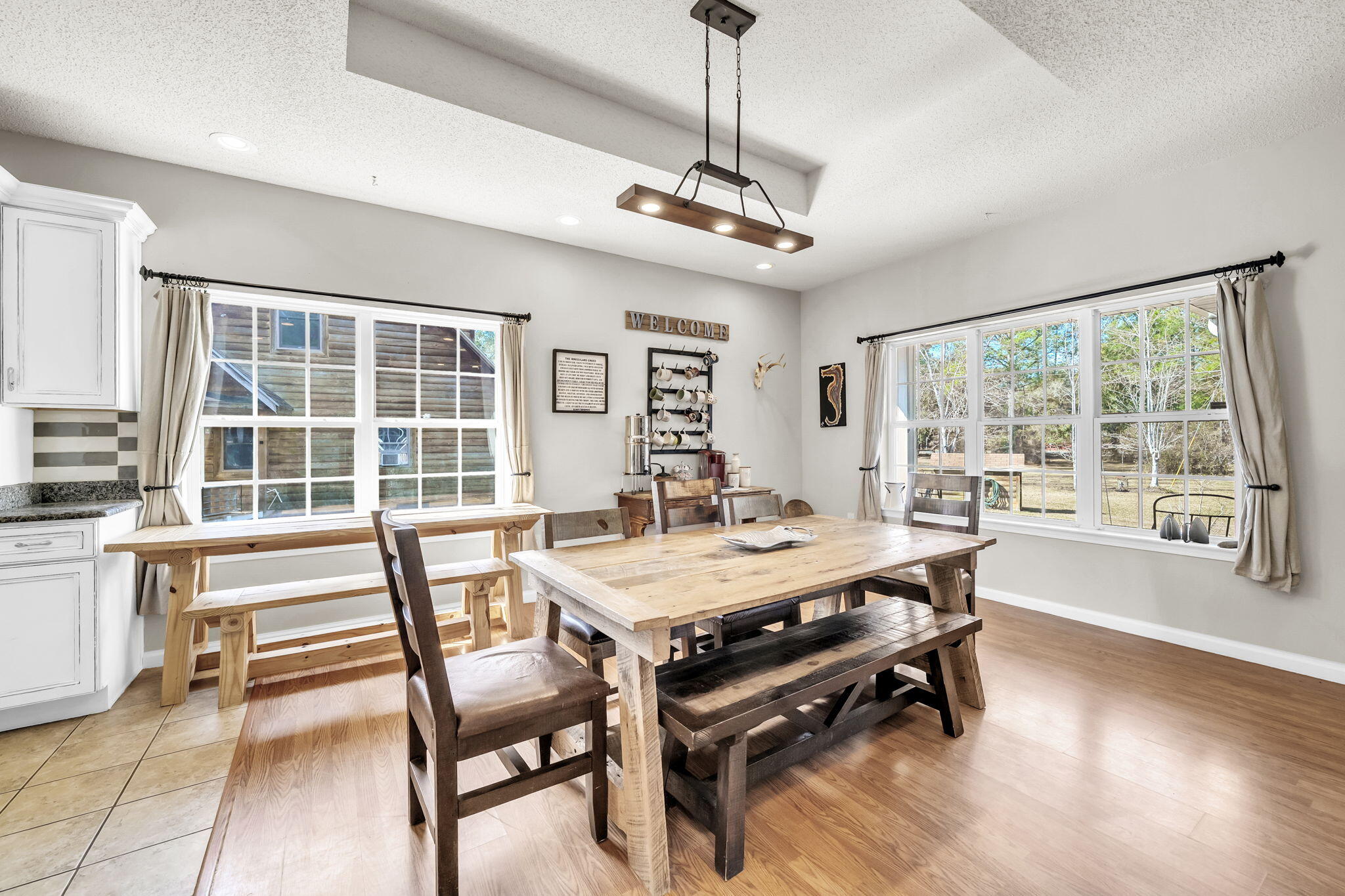 4398 Wilkerson Bluff Road Holt, FL 32564 - Photo 21 of 110 a view of a dining room with furniture window and wooden floor
