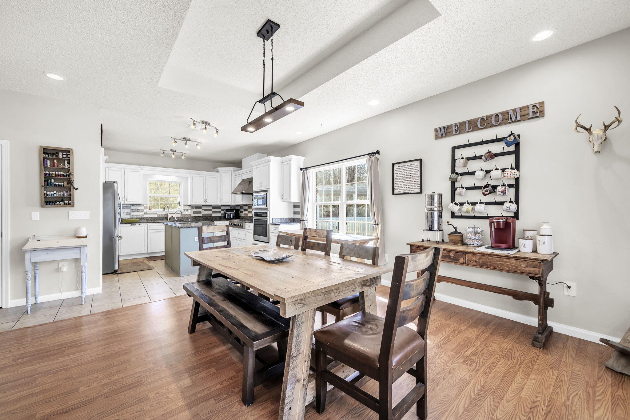 4398 Wilkerson Bluff Road Holt, FL 32564 - Photo 22 of 110 a view of a dining room with furniture and wooden floor