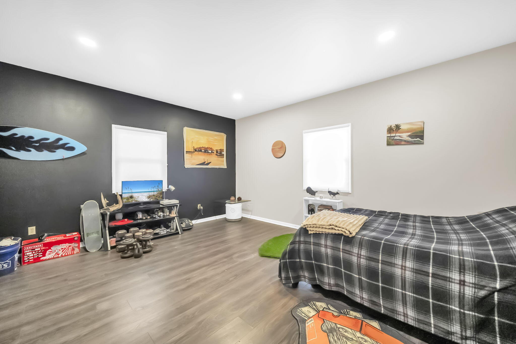 4398 Wilkerson Bluff Road Holt, FL 32564 - Photo 55 of 110 a bedroom with a bed and a chandelier