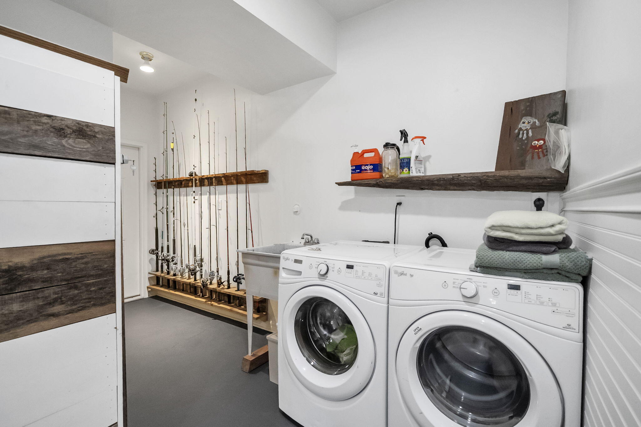 4398 Wilkerson Bluff Road Holt, FL 32564 - Photo 57 of 110 a view of storage and utility room with washer and dryer