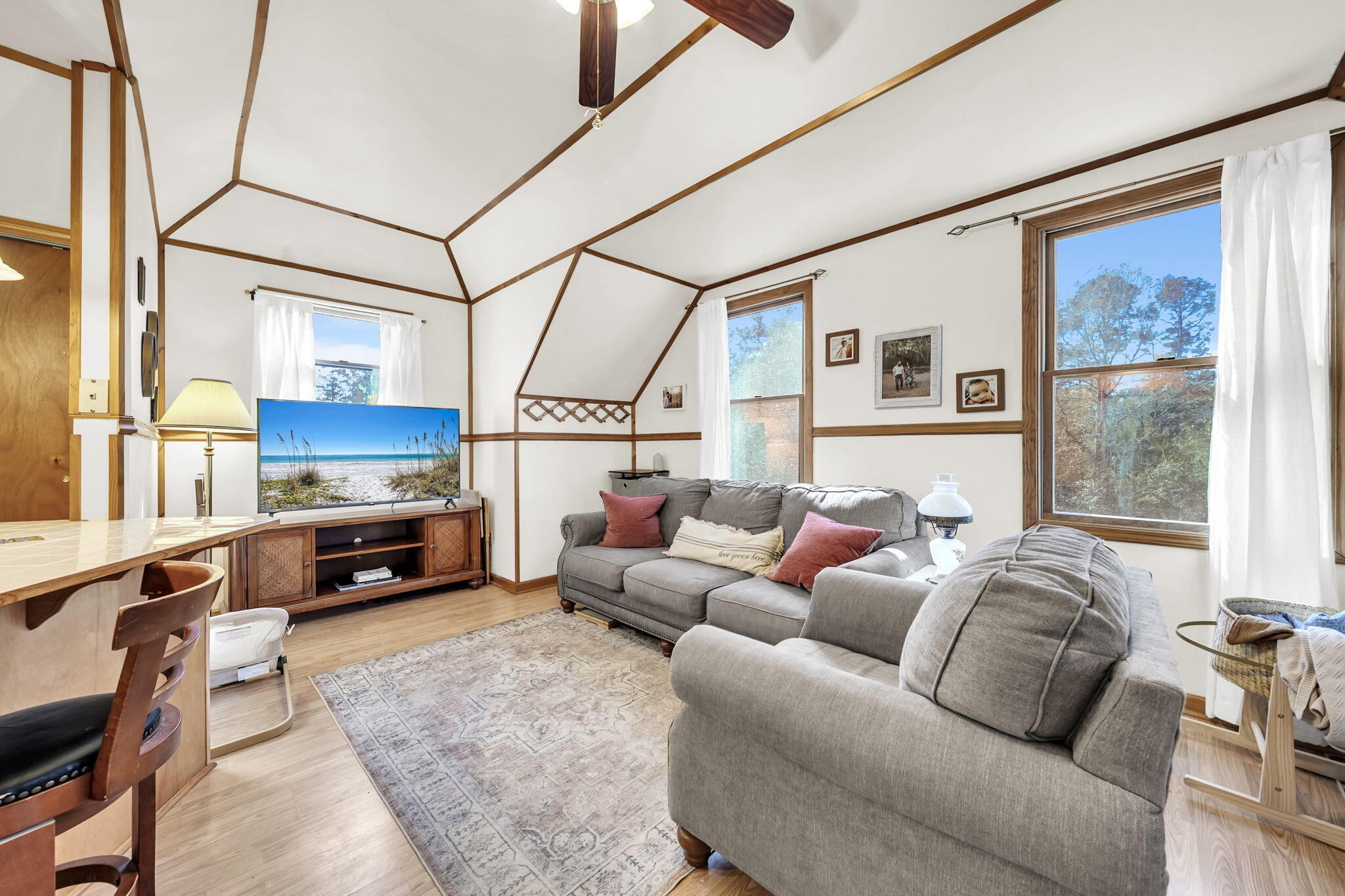 4398 Wilkerson Bluff Road Holt, FL 32564 - Photo 61 of 110 a living room with furniture and a flat screen tv