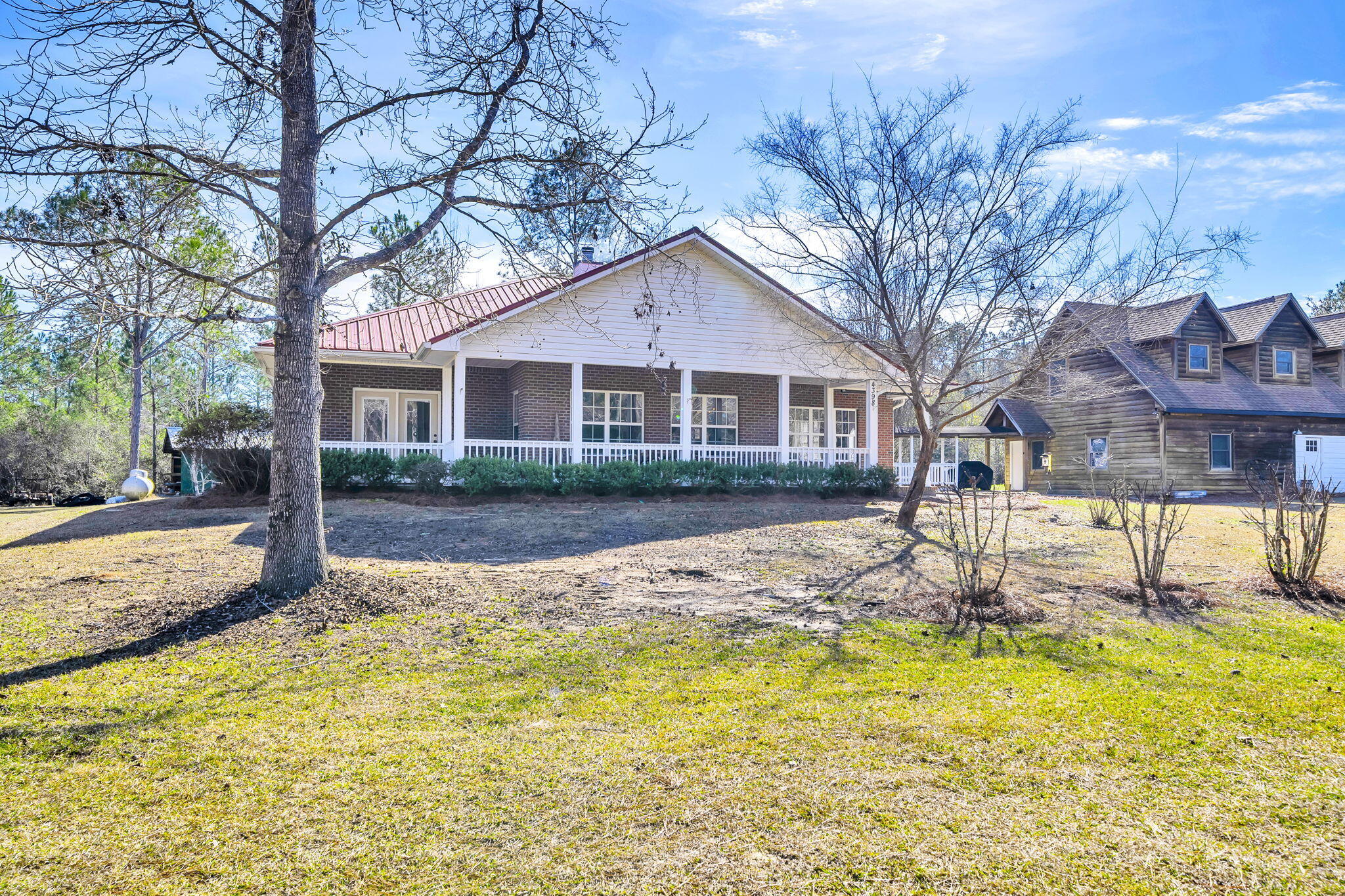 4398 Wilkerson Bluff Road Holt, FL 32564 - Photo 68 of 110 a house that has tree in front of it