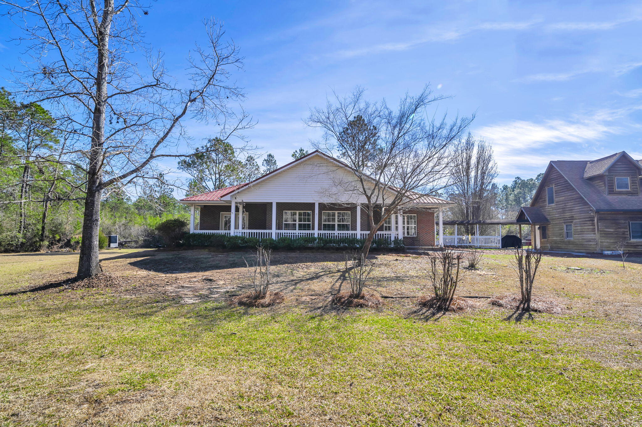 4398 Wilkerson Bluff Road Holt, FL 32564 - Photo 69 of 110 a front view of a house with a yard