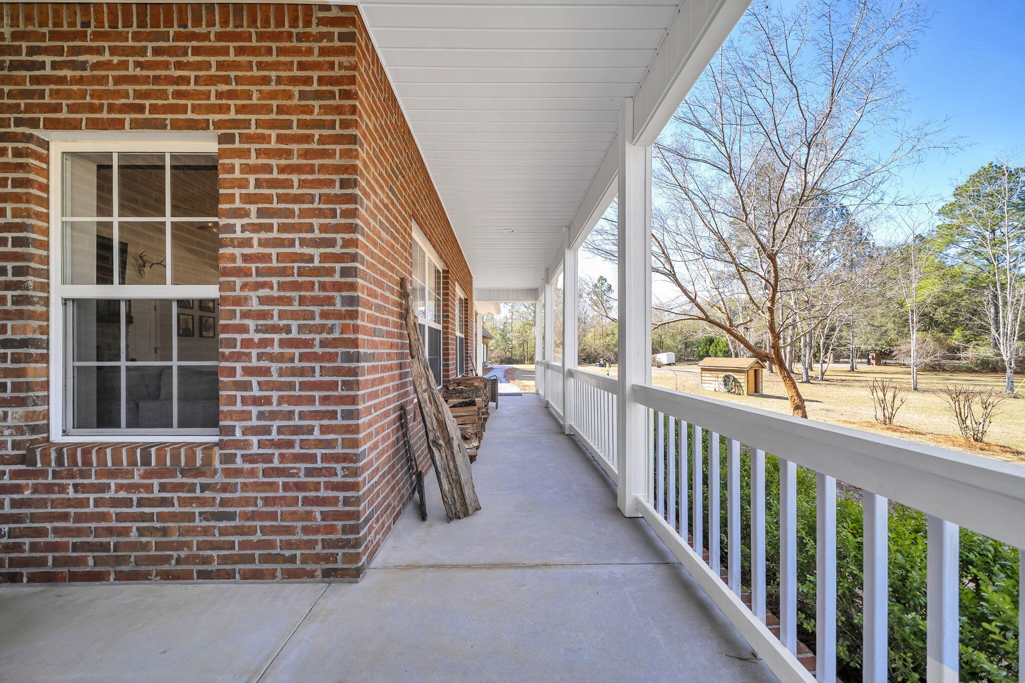 4398 Wilkerson Bluff Road Holt, FL 32564 - Photo 71 of 110 a view of a brick house with large windows