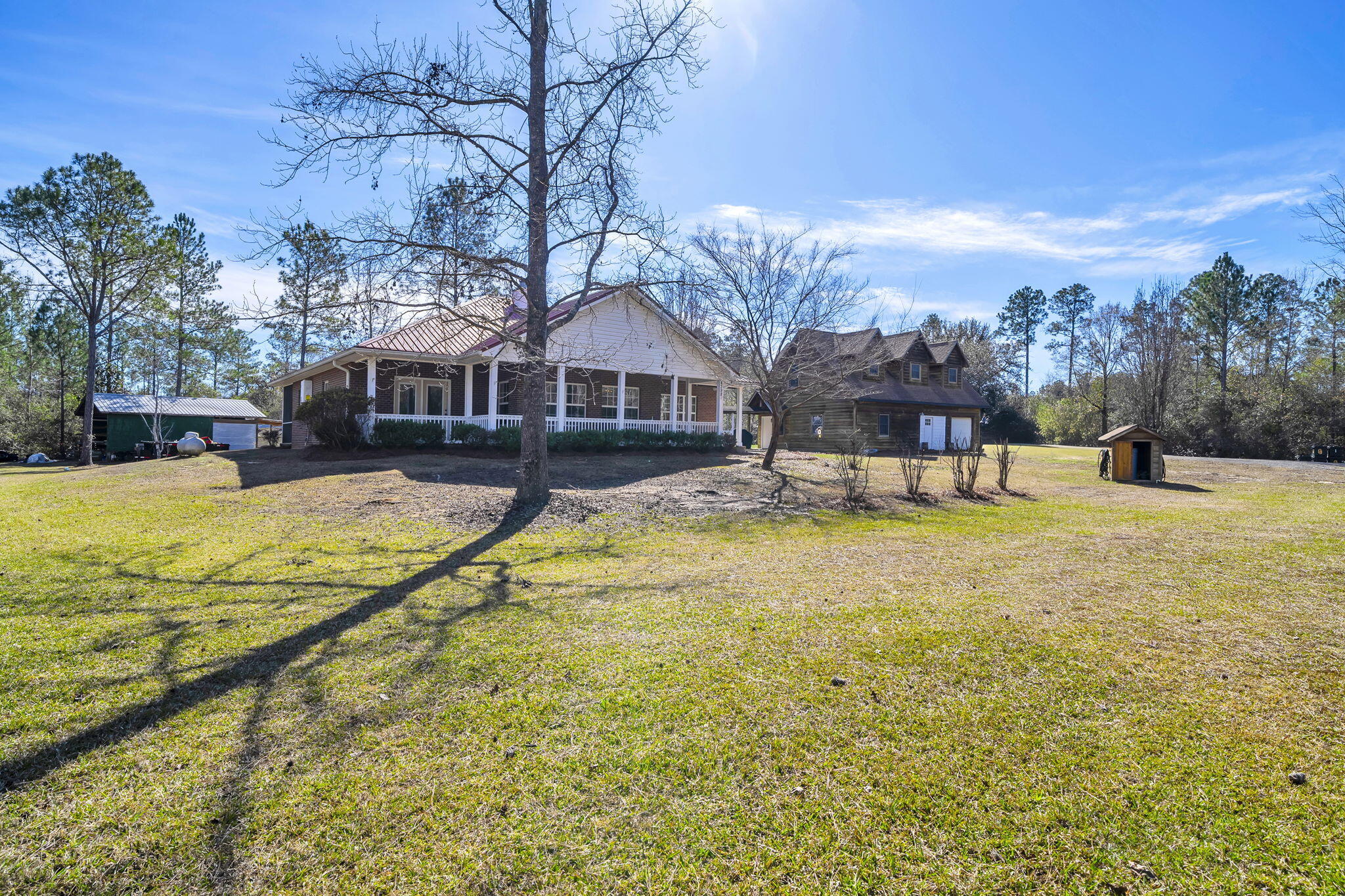 4398 Wilkerson Bluff Road Holt, FL 32564 - Photo 74 of 110 a swimming pool view with a seating space and a garden view