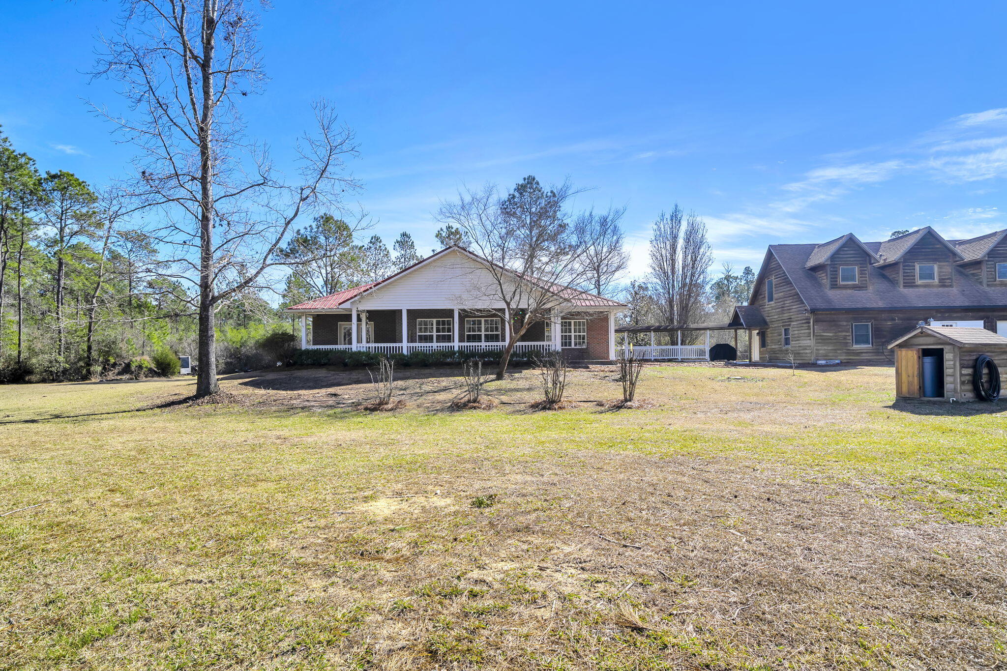 4398 Wilkerson Bluff Road Holt, FL 32564 - Photo 75 of 110 a front view of house with yard and swimming pool