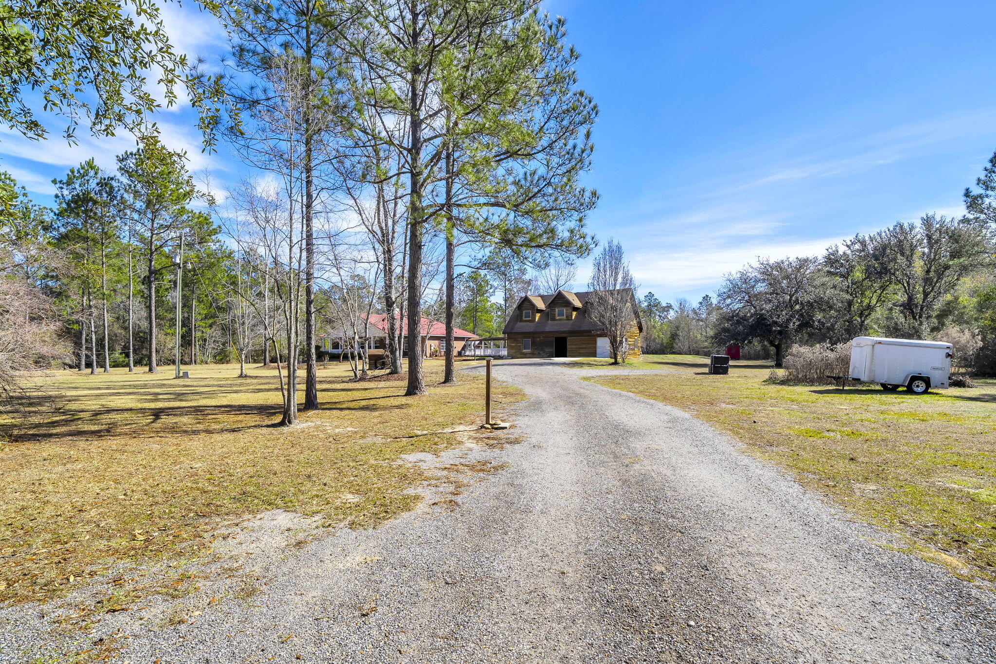 4398 Wilkerson Bluff Road Holt, FL 32564 - Photo 80 of 110 a view of road with large trees