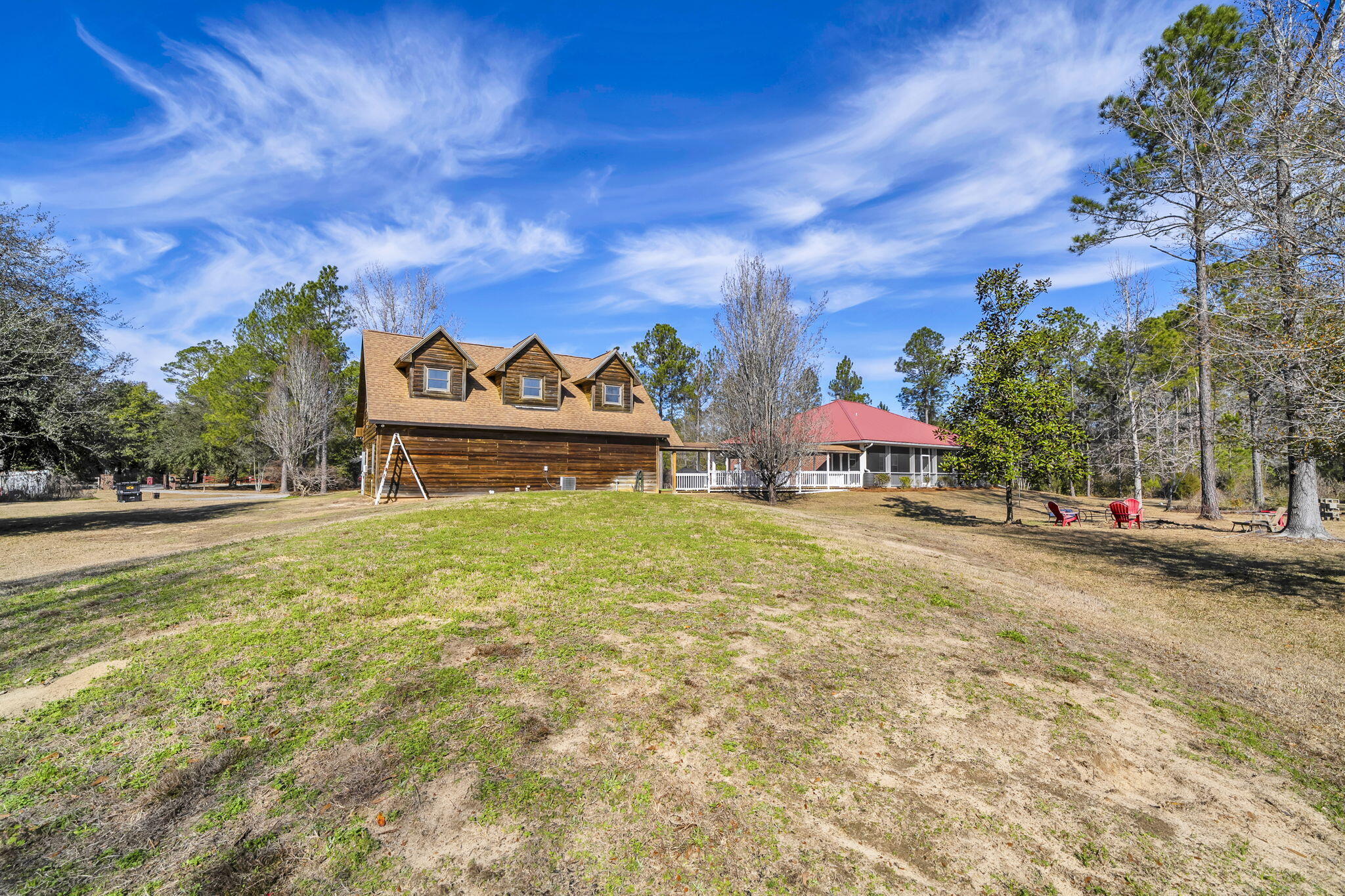 4398 Wilkerson Bluff Road Holt, FL 32564 - Photo 82 of 110 a view of a big house with a big yard and large trees