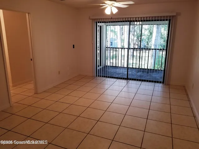a view of an empty room and a window