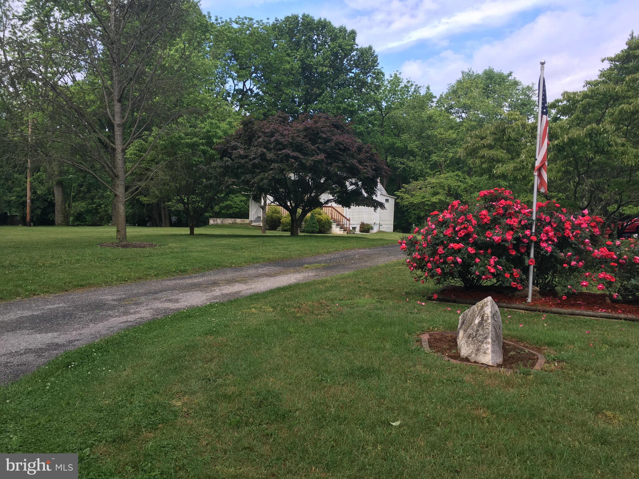 1012 Vale Road Bel Air, MD 21014 - Photo 2 of 27 a view of a garden with flowers and trees