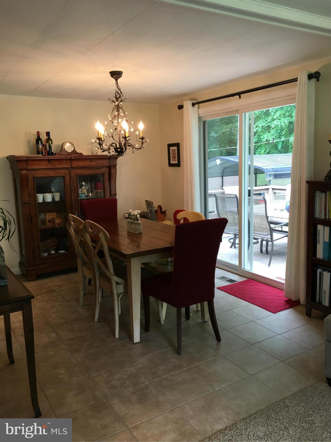 1012 Vale Road Bel Air, MD 21014 - Photo 11 of 27 a dining room with furniture and chandelier