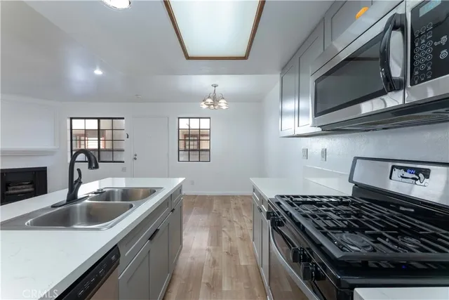 a kitchen with a faucet a sink and a fireplace