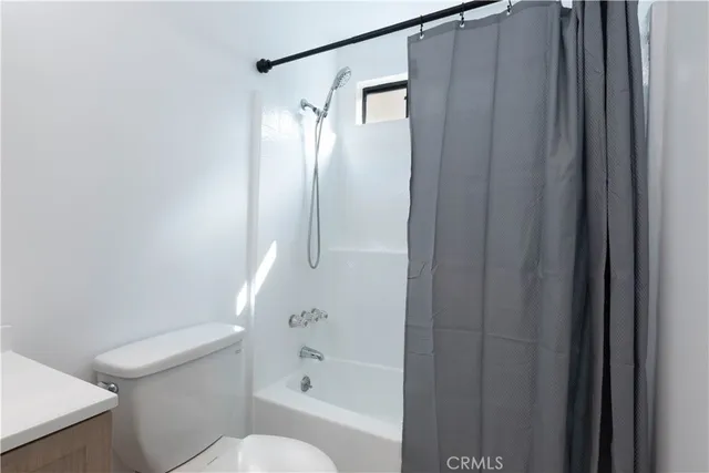 a view of a house with a garden and plants