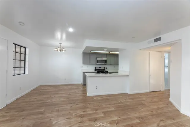 a view of a kitchen with a sink