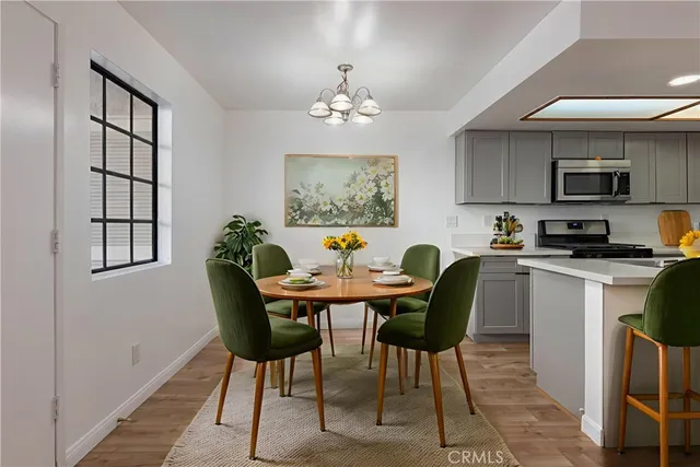 a view of a dining room with furniture and window