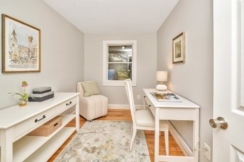 903 Main Street Bolton, MA 01740 - Photo 12 of 39 a living room with stainless steel appliances furniture a rug and a window