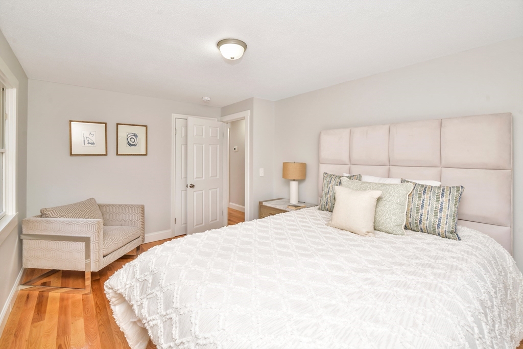 903 Main Street Bolton, MA 01740 - Photo 15 of 39 a bedroom with a bed and a couch