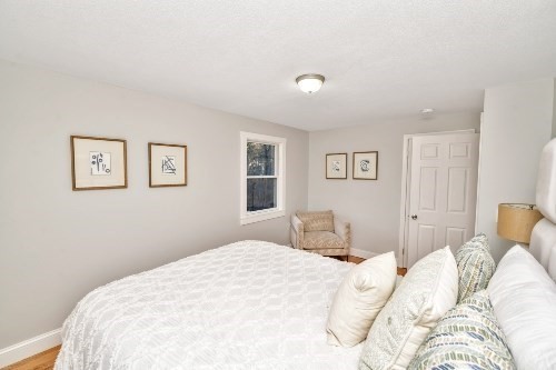 903 Main Street Bolton, MA 01740 - Photo 16 of 39 a bedroom with a large bed and a window
