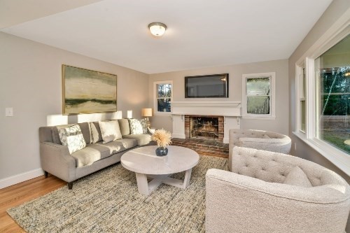 903 Main Street Bolton, MA 01740 - Photo 20 of 39 a living room with furniture and a fireplace