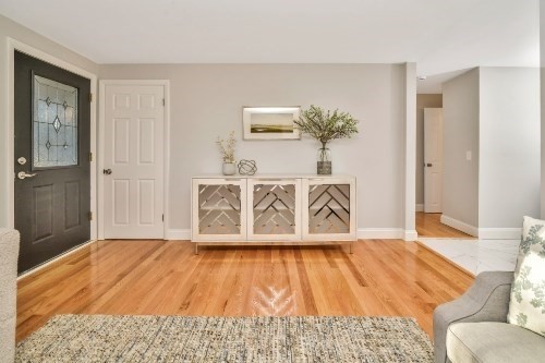 903 Main Street Bolton, MA 01740 - Photo 22 of 39 a bedroom with a bed and wooden floor