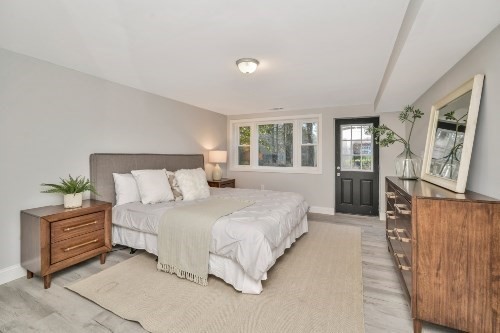 903 Main Street Bolton, MA 01740 - Photo 26 of 39 a spacious bedroom with a bed and window