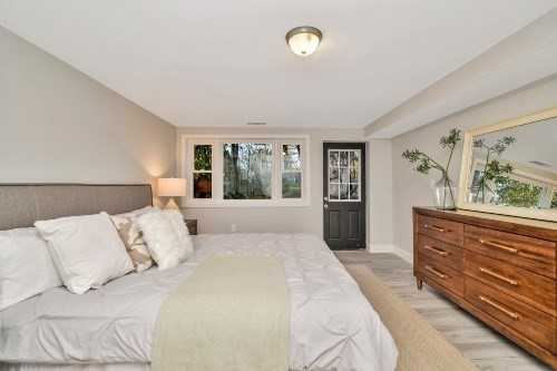 903 Main Street Bolton, MA 01740 - Photo 27 of 39 a bedroom with a large bed and a window