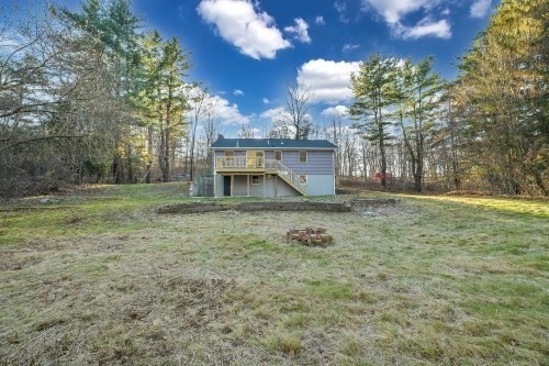 903 Main Street Bolton, MA 01740 - Photo 36 of 39 a view of a house with a yard