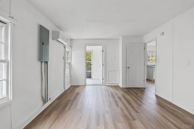 a view of hallway with wooden floor