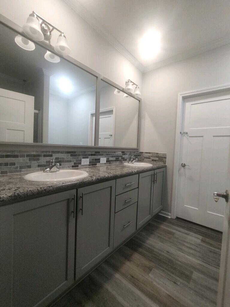 31343 Ave I Big Pine Key, FL 33043 - Photo 12 of 29 a spacious bathroom with a granite countertop sink and a mirror