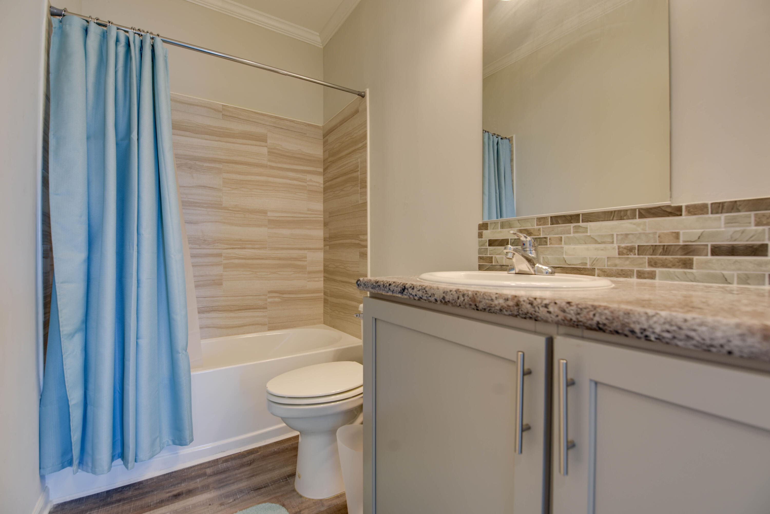 31343 Ave I Big Pine Key, FL 33043 - Photo 16 of 29 a bathroom with a granite countertop sink toilet and shower