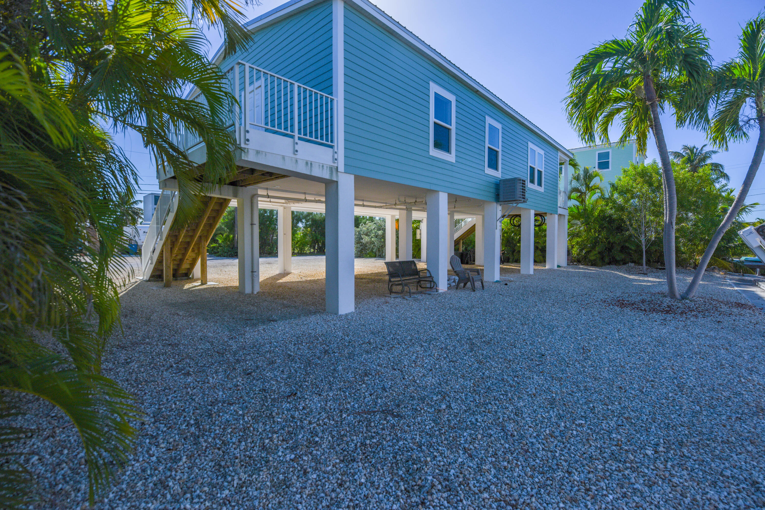 31343 Ave I Big Pine Key, FL 33043 - Photo 24 of 29 a view of a house with backyard and a tree