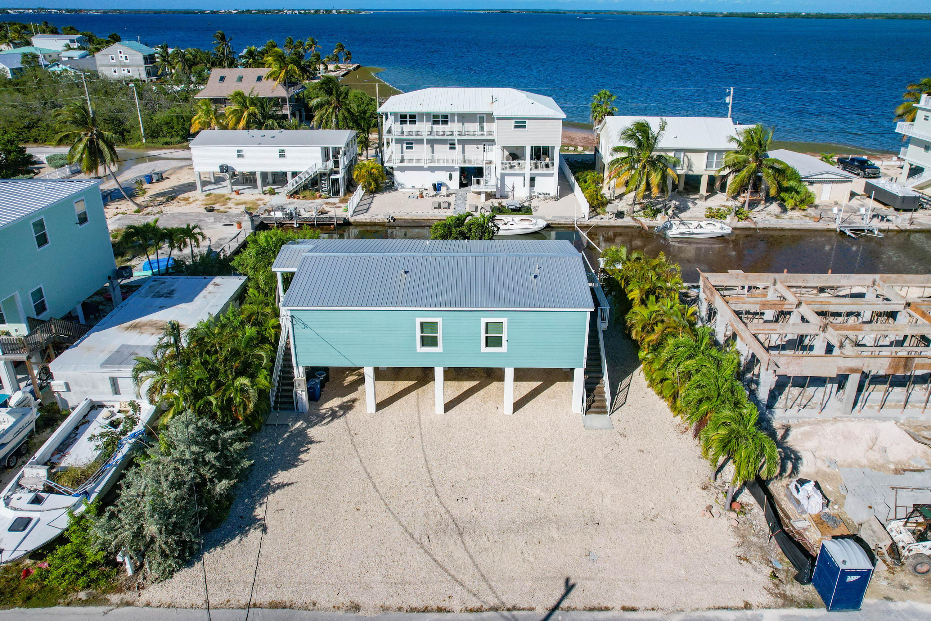 31343 Ave I Big Pine Key, FL 33043 - Photo 26 of 29 an aerial view of multiple houses with yard