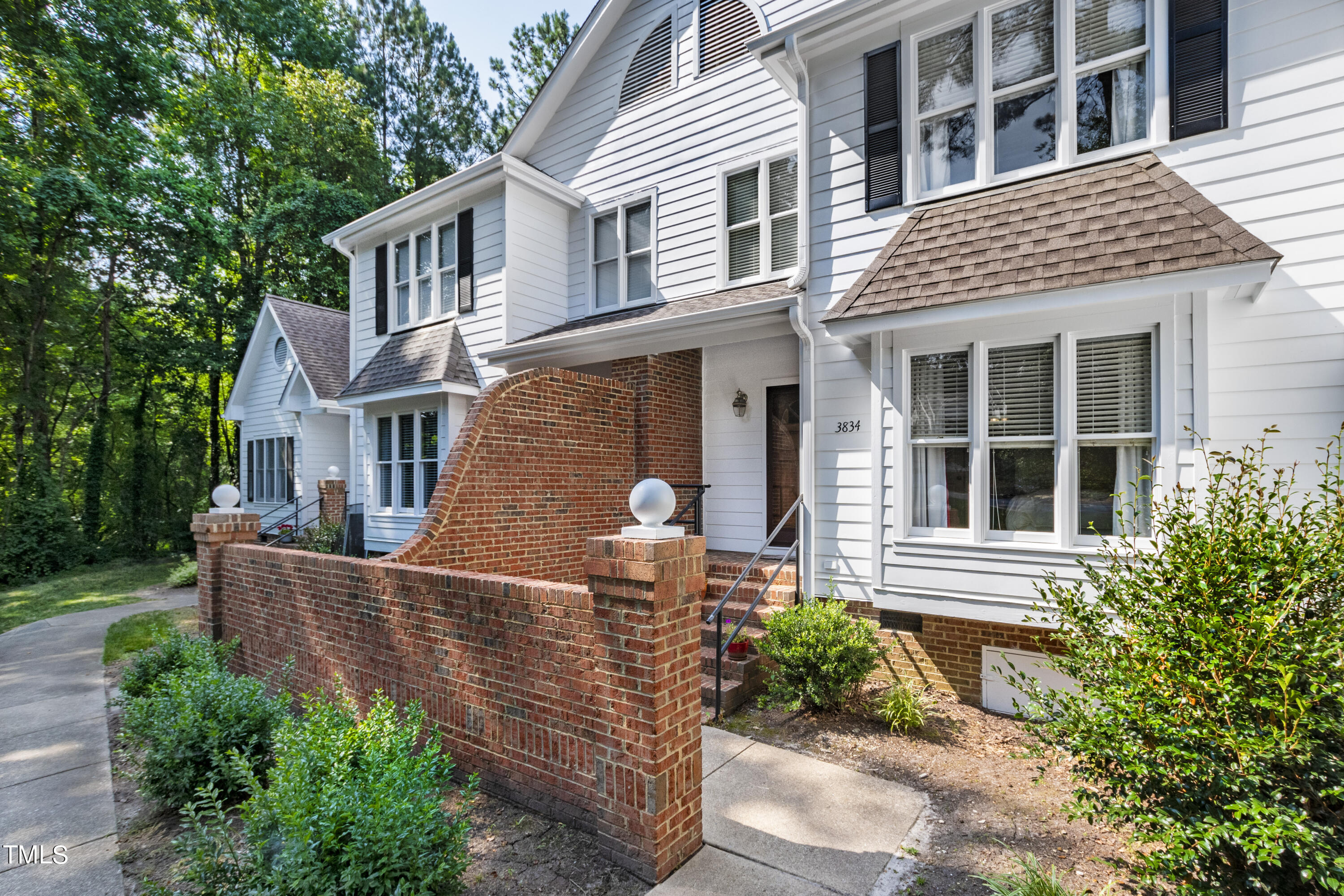 3834 Carnegie Lane Raleigh, NC 27612 - Photo 1 of 38 a front view of a house with garden