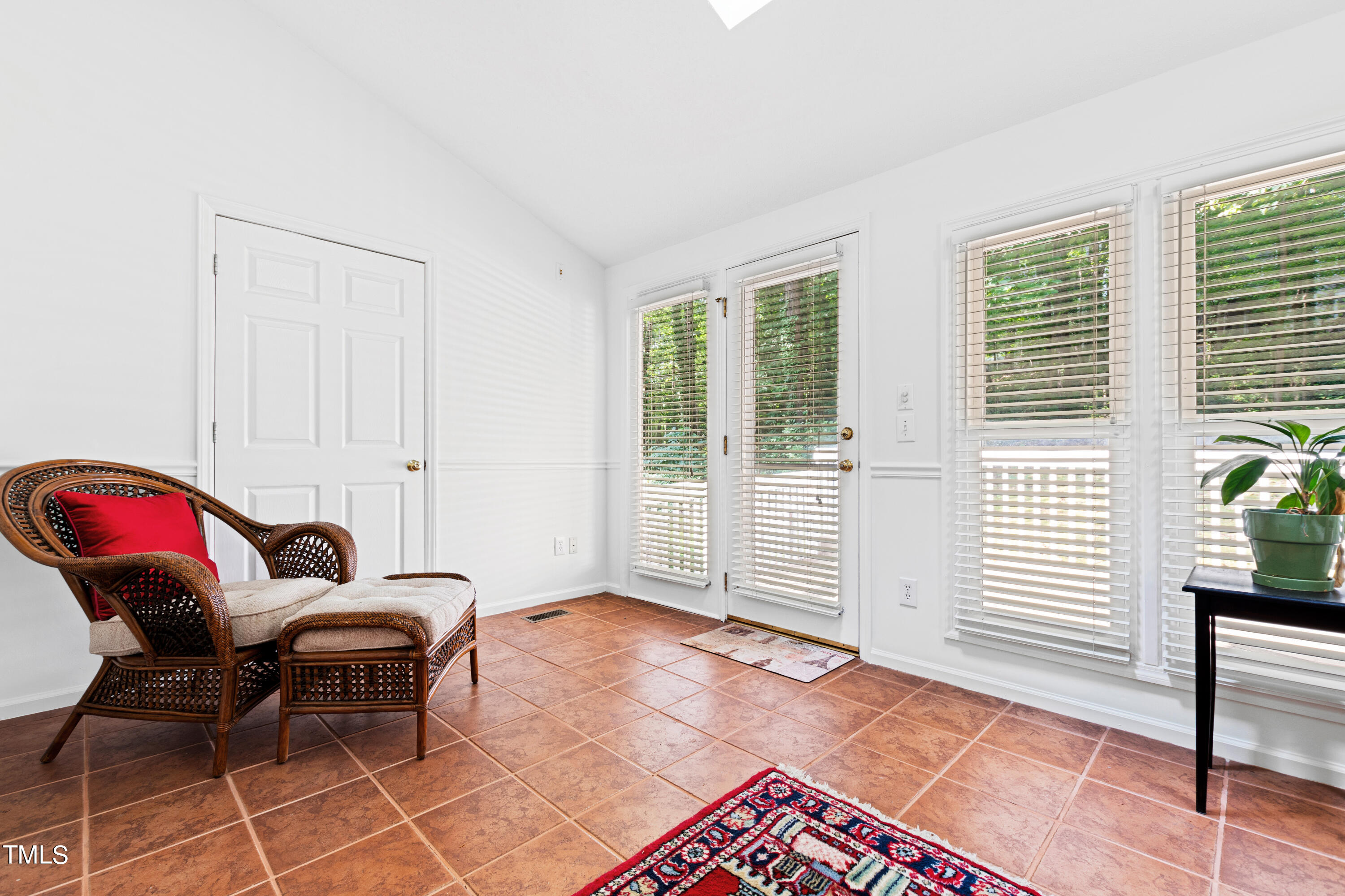 3834 Carnegie Lane Raleigh, NC 27612 - Photo 20 of 38 a living room with furniture a rug and a window