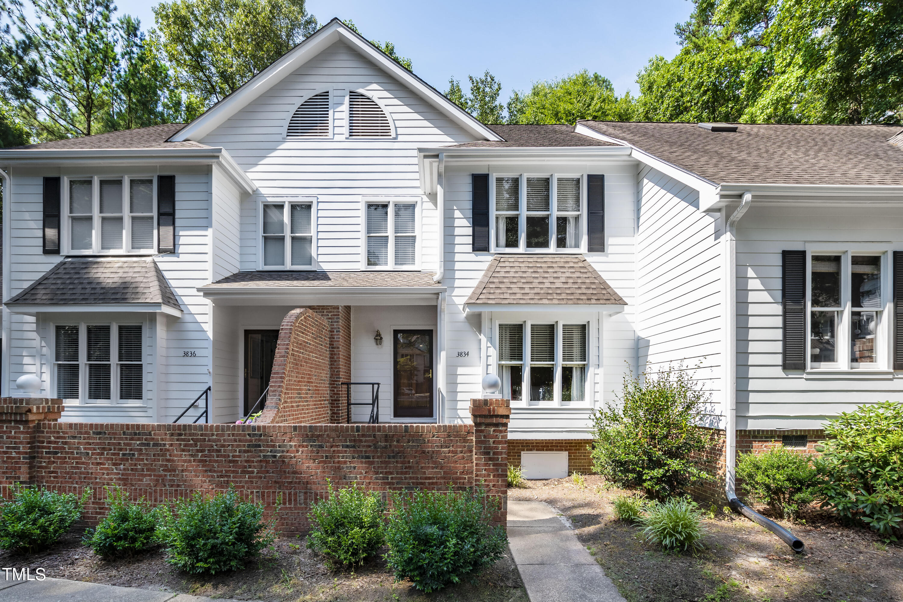 3834 Carnegie Lane Raleigh, NC 27612 - Photo 2 of 38 a front view of a house with garden