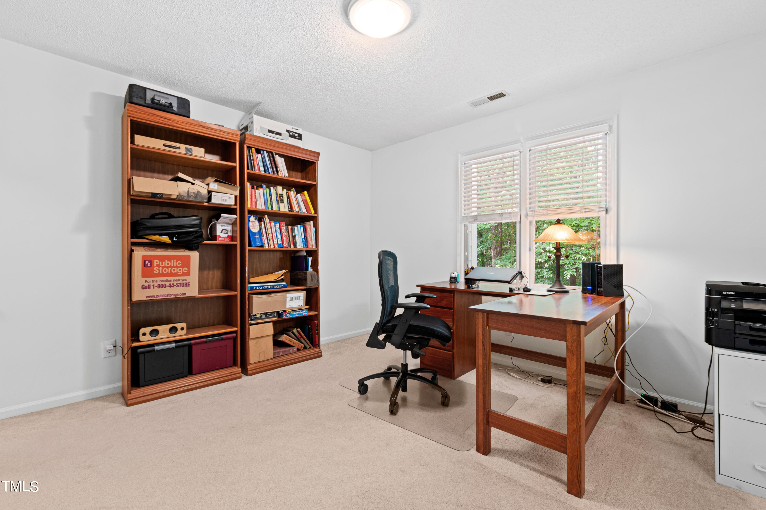 3834 Carnegie Lane Raleigh, NC 27612 - Photo 31 of 38 a view of a workspace with furniture and a window